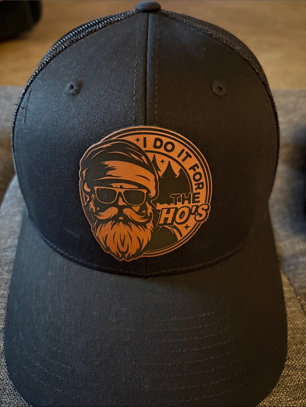 Black Trucker Cap with Orange Graphic "I Do It For The Ho's"